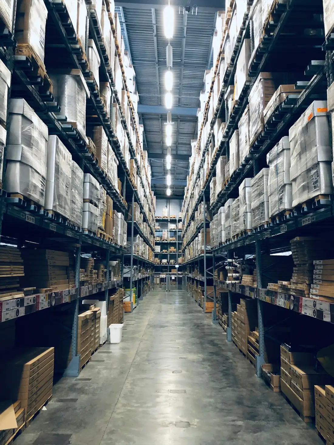 Aisle of a logistics warehouse with storage racks